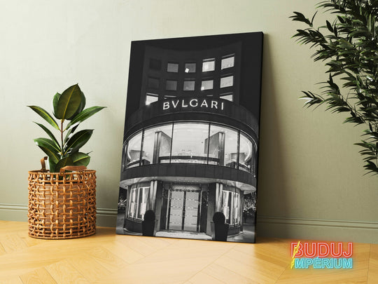 Luxury canvas print with a black and white photograph of a Bvlgari boutique entrance, leaning against a wall beside a green plant
