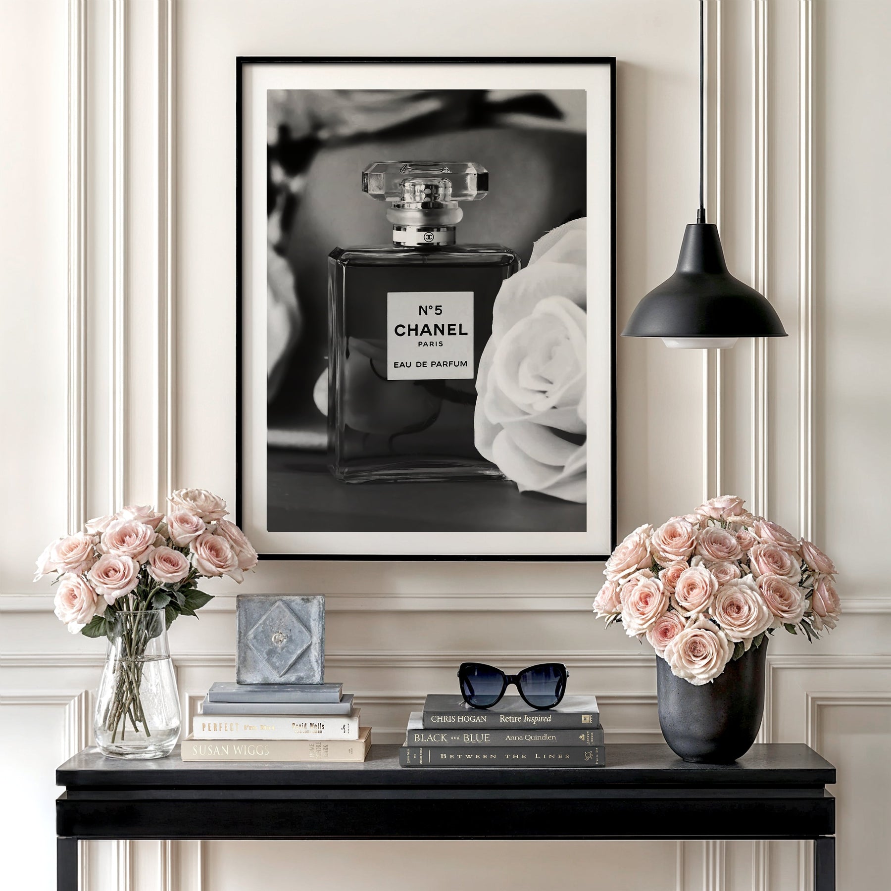 Luxury wall art with a black and white perfume bottle and a white rose in an elegant interior.