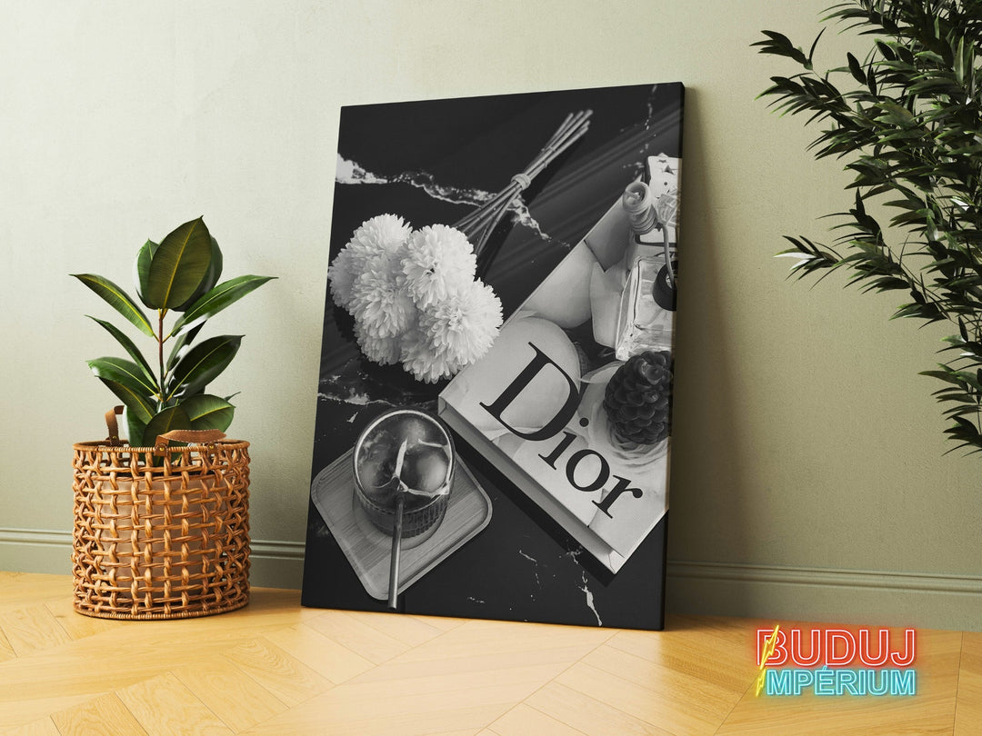 Luxury Dior canvas wall art in a black and white composition with flowers, perfume and a candle in a modern interior.
