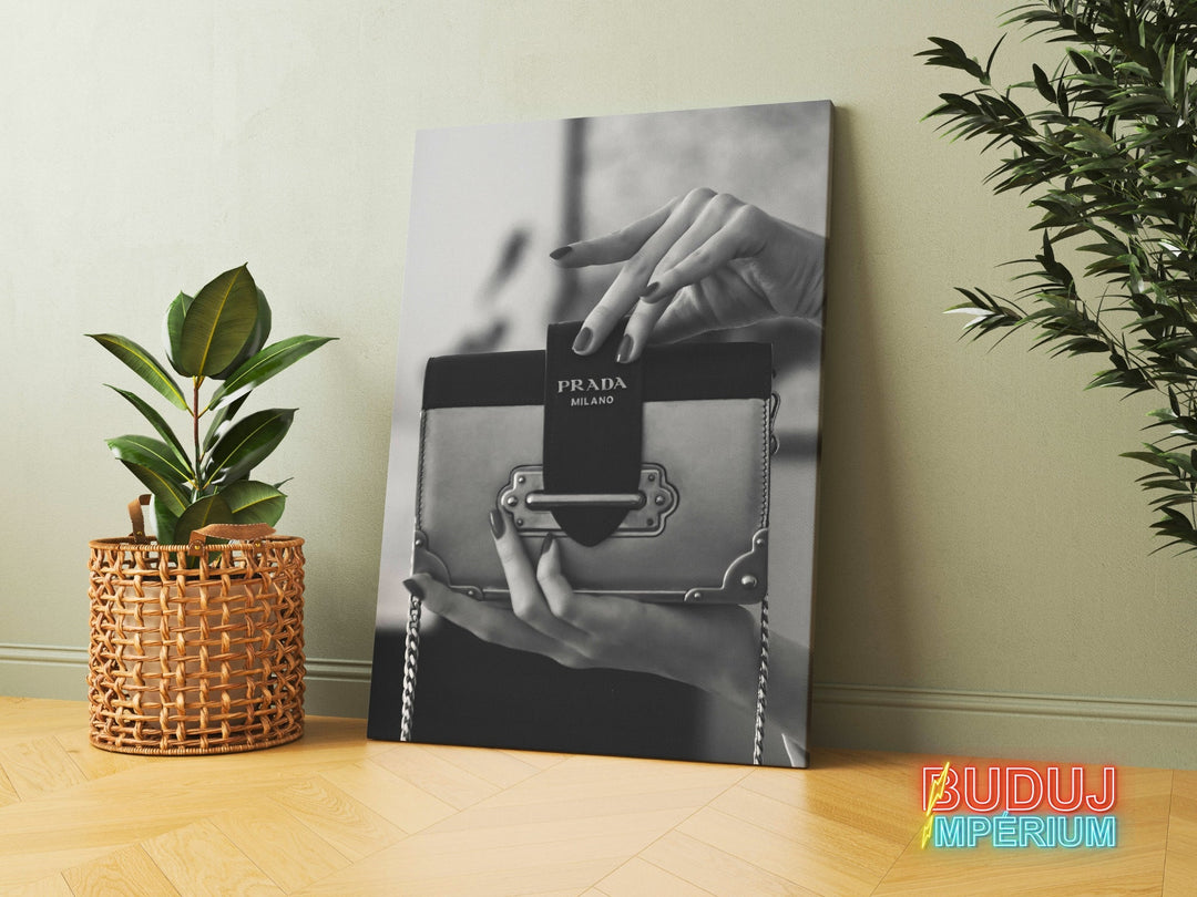 Motivational canvas print with a black and white photograph of a Prada handbag in a modern interior