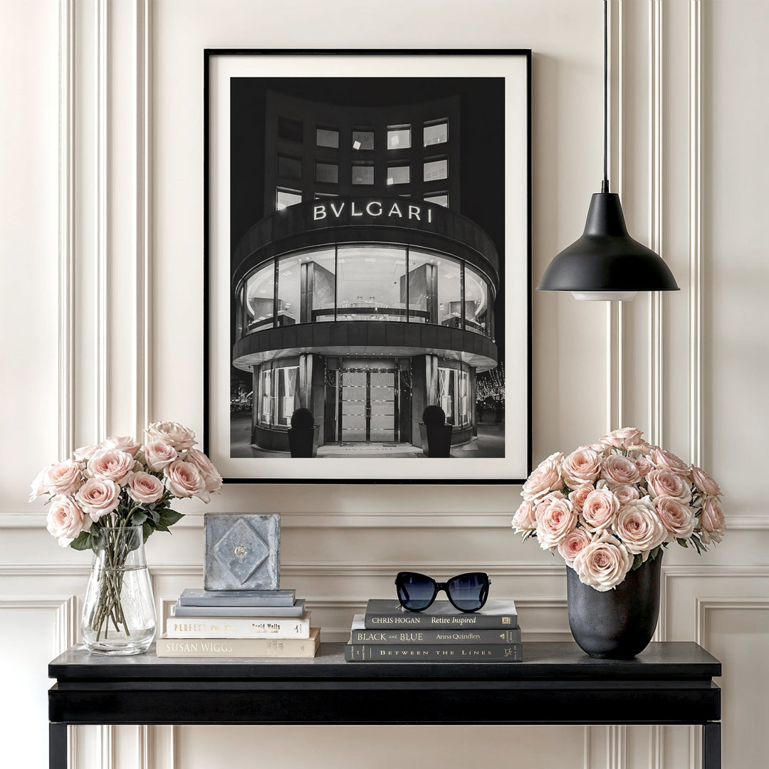 Motivational wall art with a black and white photograph of a BVLGARI store, roses and minimalist interior decor