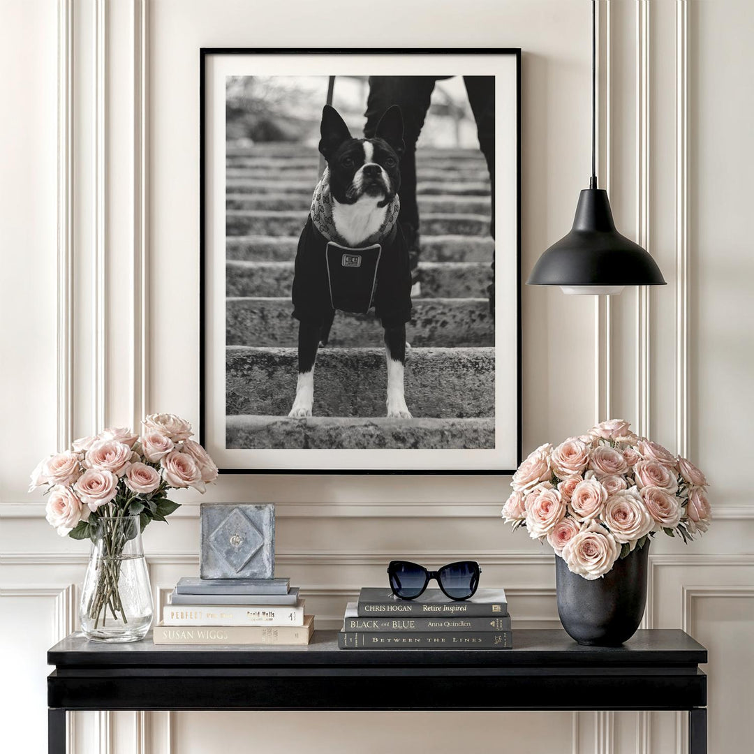 Luxury motivational canvas wall art with a black and white dog wearing a collar on stairs in an elegant interior.