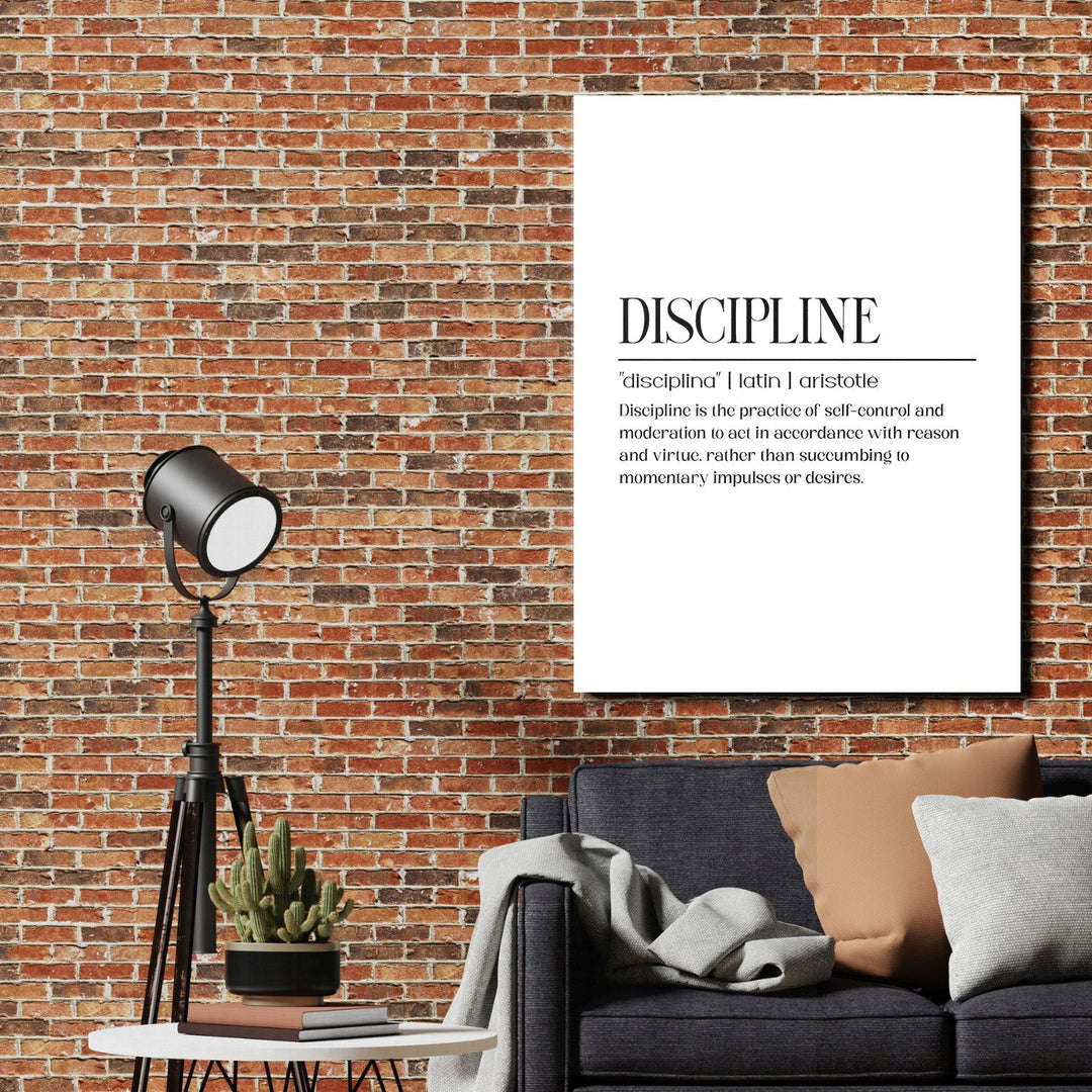 Discipline motivational wall art with a quote in an industrial living room with a brick wall