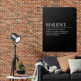 Motivational canvas print with the word Resilience on a brick wall in an industrial interior