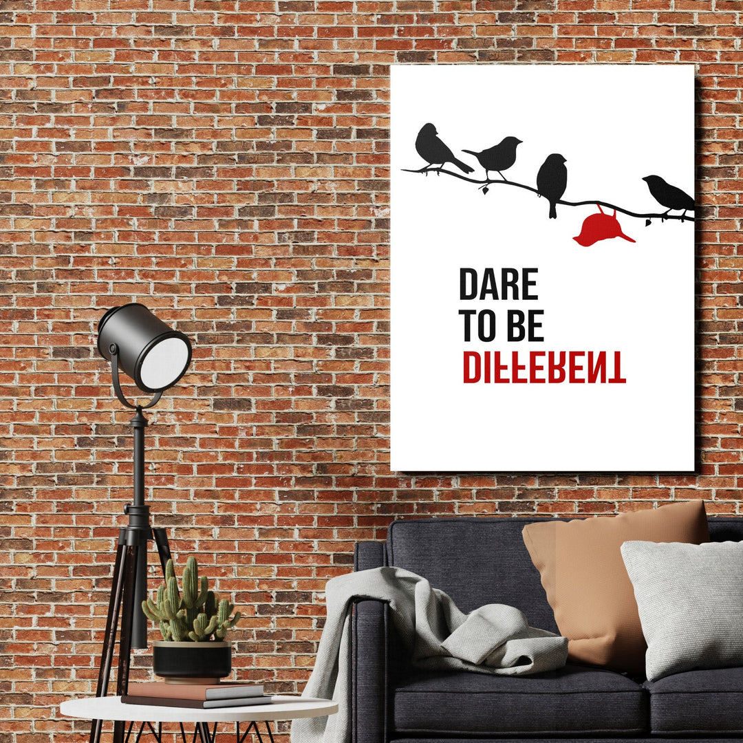 Motivational wall art on a brick wall with minimalist birds, a red cap and a quote