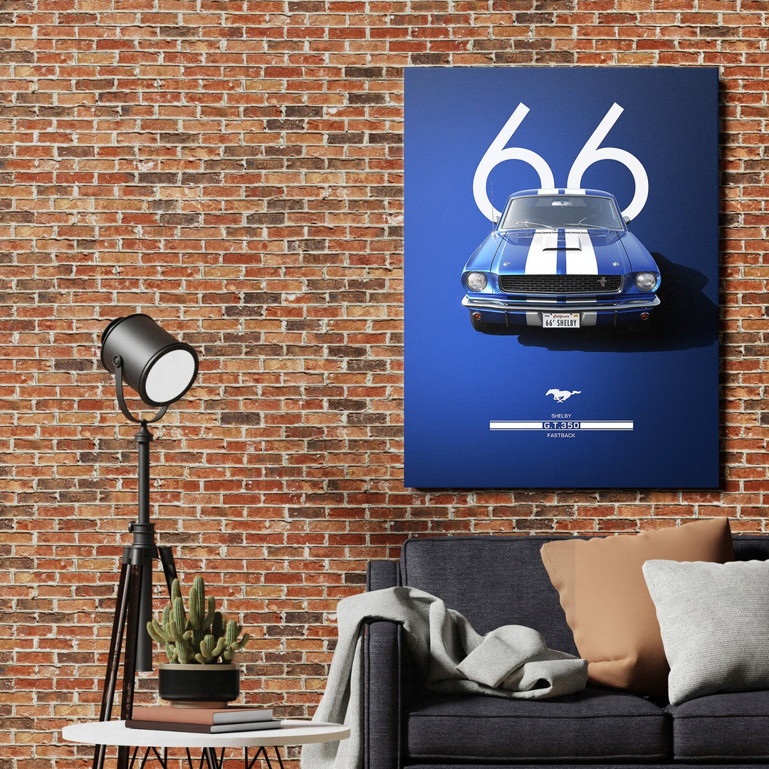 Motivational wall art with a blue Shelby ’66 fastback in front of a brick wall in a living room