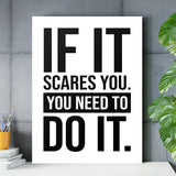Motivational canvas print with a black-and-white quote in a minimalist office by a concrete wall