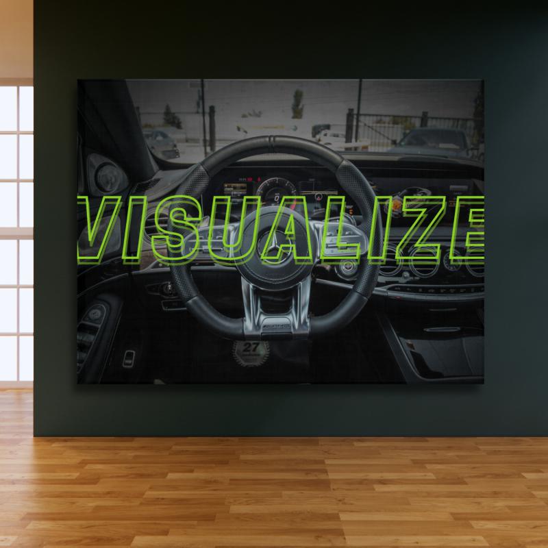 Motivational wall art in a modern office with a luxury AMG steering wheel and green "VISUALIZE" text