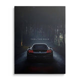 Luxury canvas wall art Ferrari on night forest road, red tail lights and quote Feel the Calm, front view