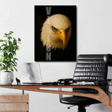 Motivational canvas wall art with a realistic eagle head and VISION text hanging above a desk in an office.