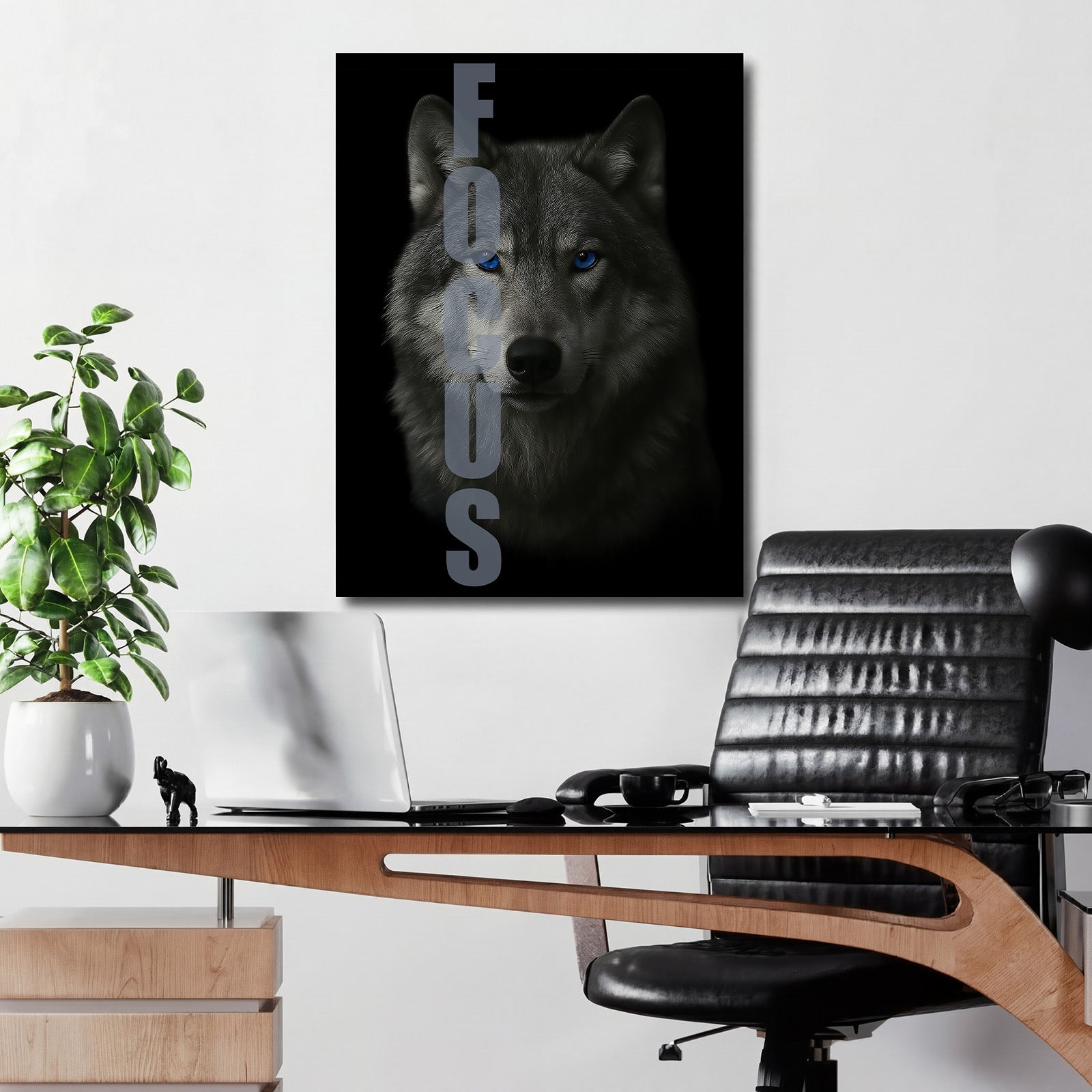 Motivational wall art with an intense wolf gaze and FOCUS text in a modern office.