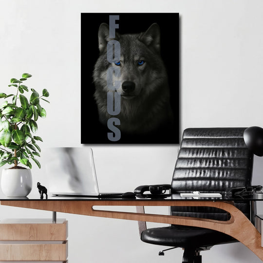 Motivational wall art with an intense wolf gaze and FOCUS text in a modern office.