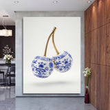 Luxury canvas print with blue-and-white porcelain cherries and gold stems in a modern interior