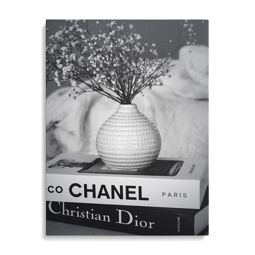 Luxury canvas print with black and white Chanel and Christian Dior book spines