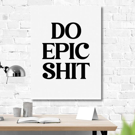 Motivational wall art with black “Do Epic Shit” text in a modern office above a minimalist desk.