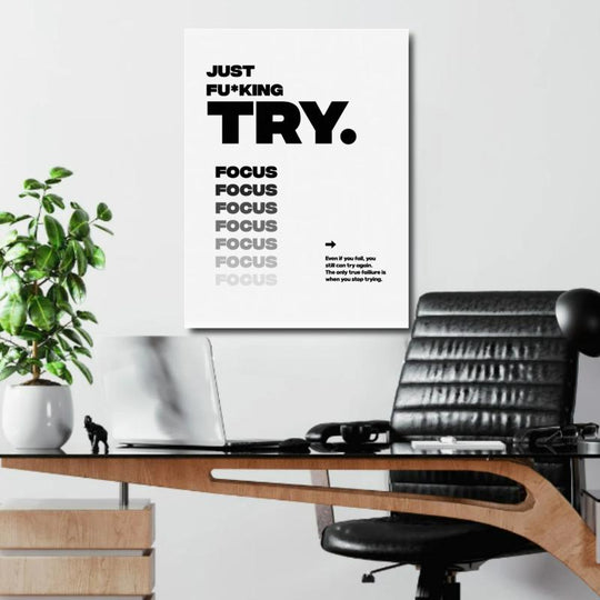 Motivational office poster with black-and-white “Just F*cking TRY” typography and repeated focus text.