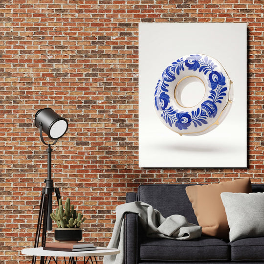 Modern canvas print with a blue-and-white porcelain motif above a sofa on a brick wall