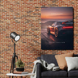 Motivational wall art with luxury sports car at sunset above sofa in an industrial living room
