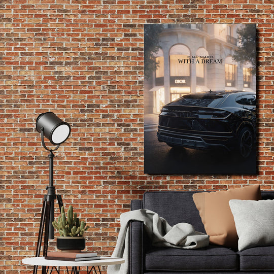 Motivational canvas print with a luxury car and the quote “It All Starts With a Dream” in a modern interior