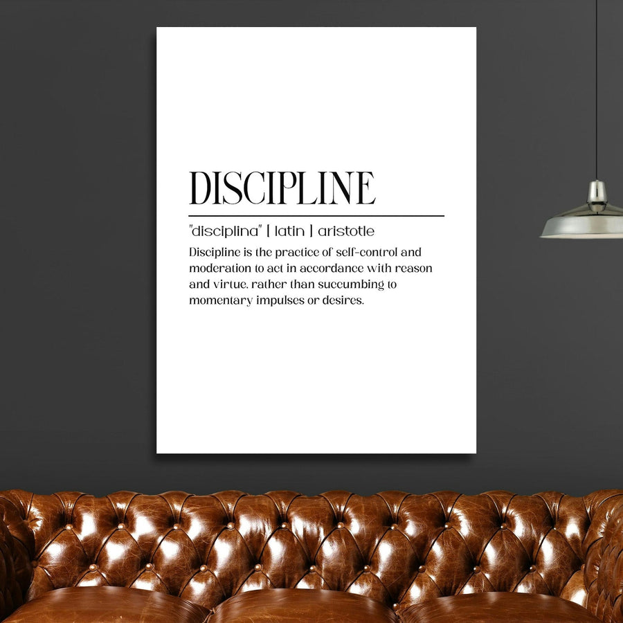 Discipline motivational canvas wall art with a quote in a modern living room above a brown leather sofa