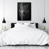 Motivational canvas wall art with a realistic wolf and FOCUS text in a modern minimalist bedroom.