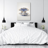 Modern canvas print with a pearl shell above a bed in a white bedroom, minimalist interior