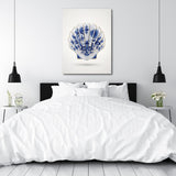 Motivational canvas print with a Delft blue-and-white shell in a bedroom, minimalist modern design