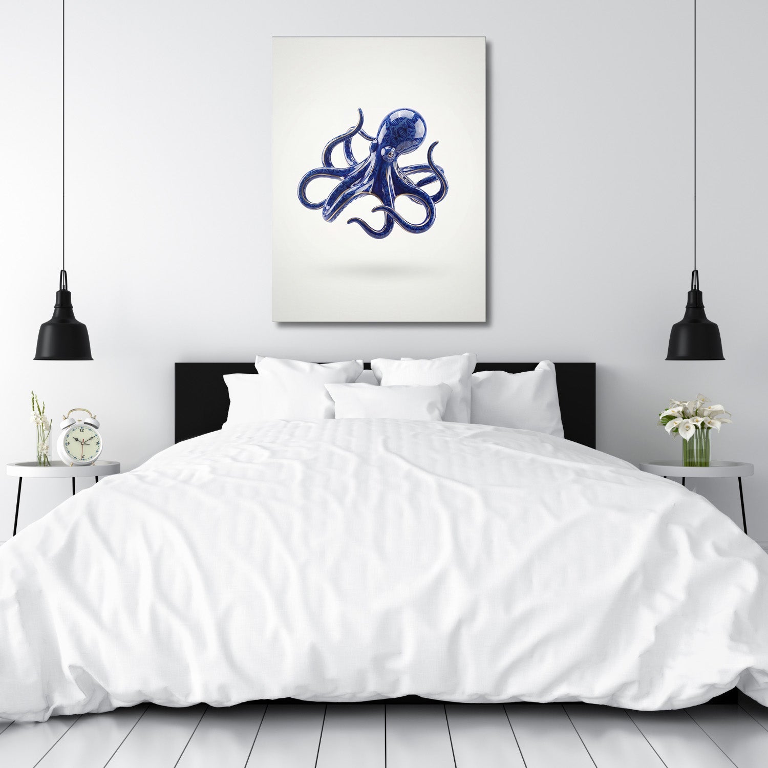 Modern canvas print with a stylized blue octopus above a double bed in a bedroom