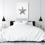Modern wall art in a bedroom with a blue-and-white ceramic starfish and clean minimalist design