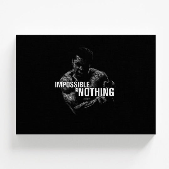 Motivational wall art with a black-and-white silhouette of Muhammad Ali and the bold typography quote “Impossible Is Nothing.”