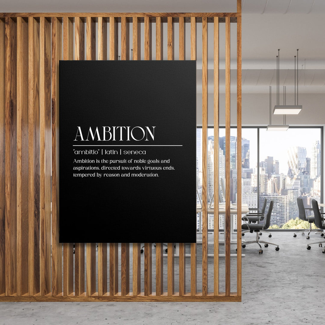 Motivational canvas wall art with an “AMBITION” inscription in a modern office with a wooden screen and city skyline view