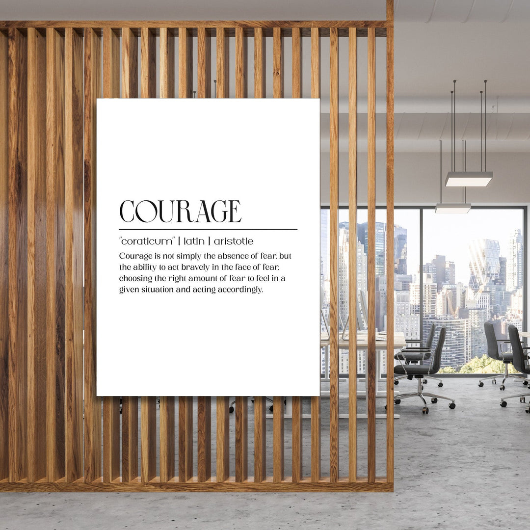 Motivational canvas wall art with a minimalist “Courage” inscription hanging in a modern office