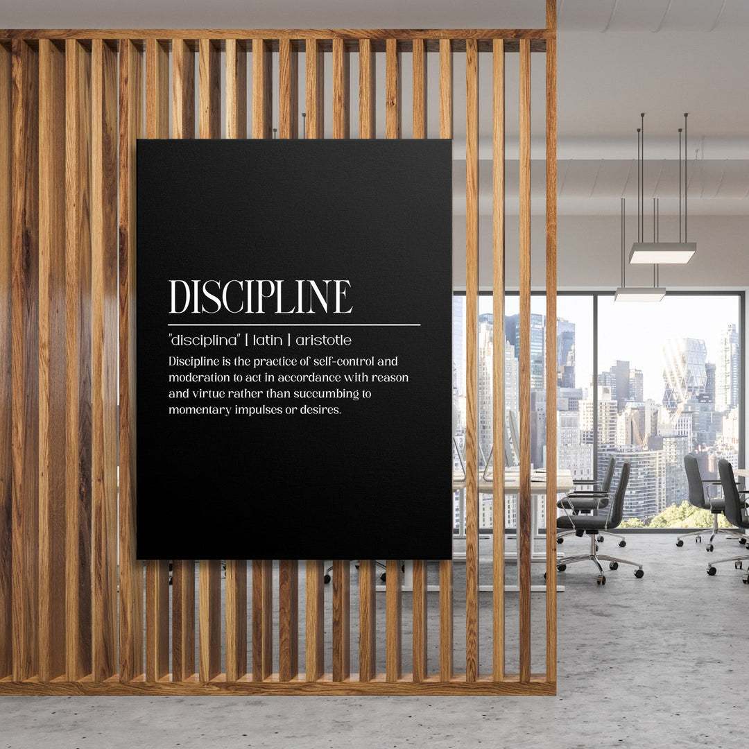 Motivational canvas wall art with an Aristotle quote about discipline in a modern office behind wooden slats