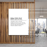 DISCIPLINE motivational canvas wall art with an Aristotle definition hanging in a modern office by a wooden partition