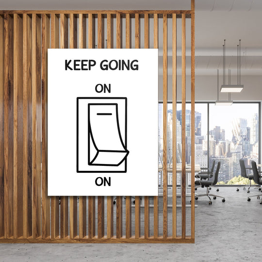 KEEP GOING motivational wall art with a black and white minimalist switch design in a modern office