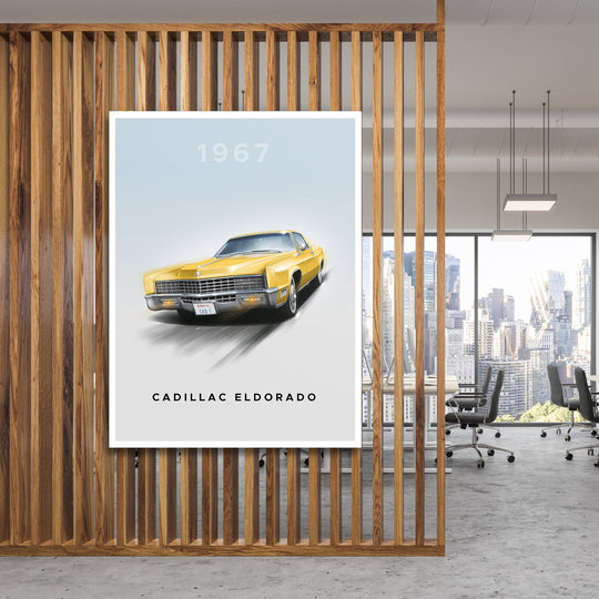 Motivational canvas wall art with a yellow 1967 Cadillac Eldorado hanging behind wooden slats in an office