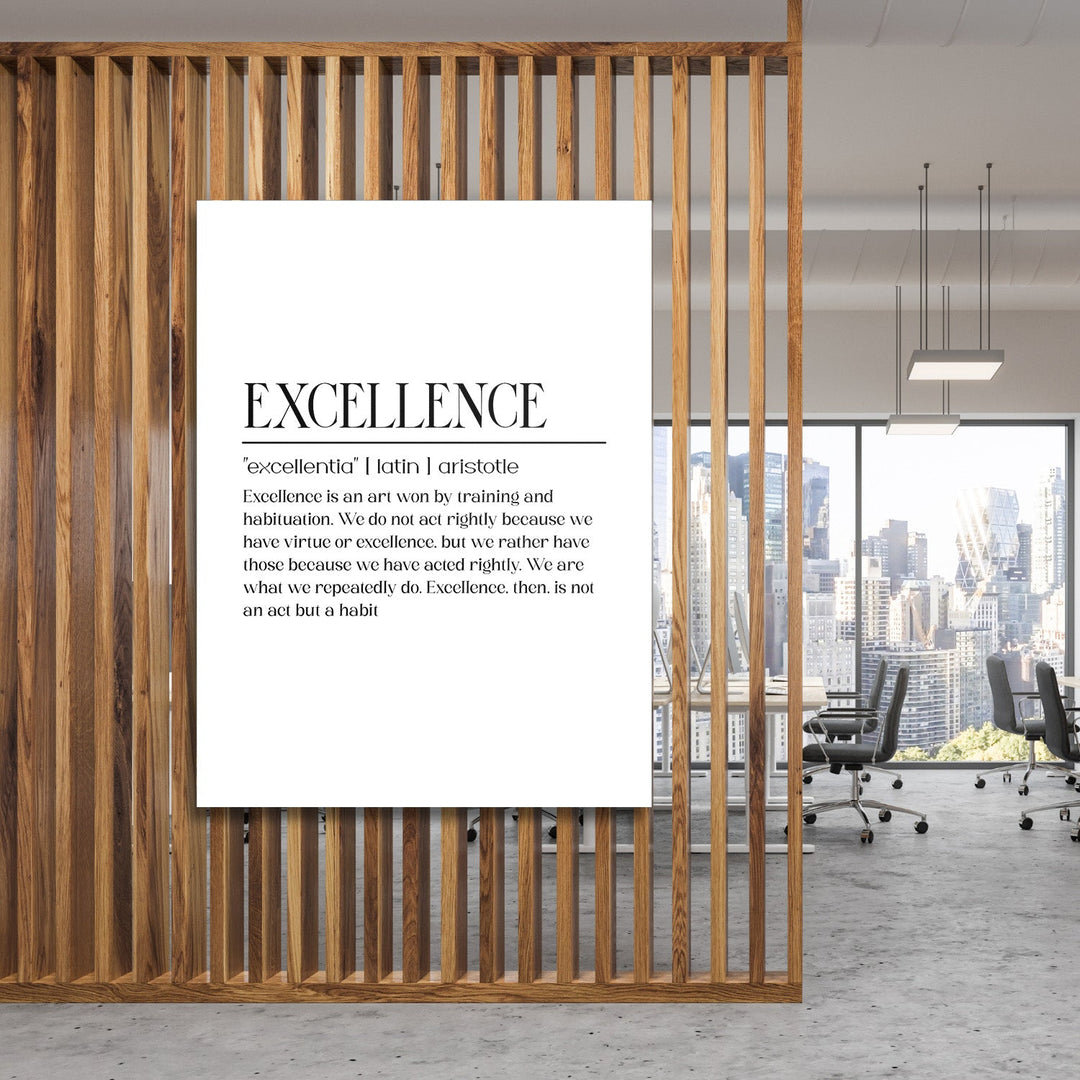 Excellence motivational canvas wall art with a black and white quote and city scene, hanging on a wooden office partition