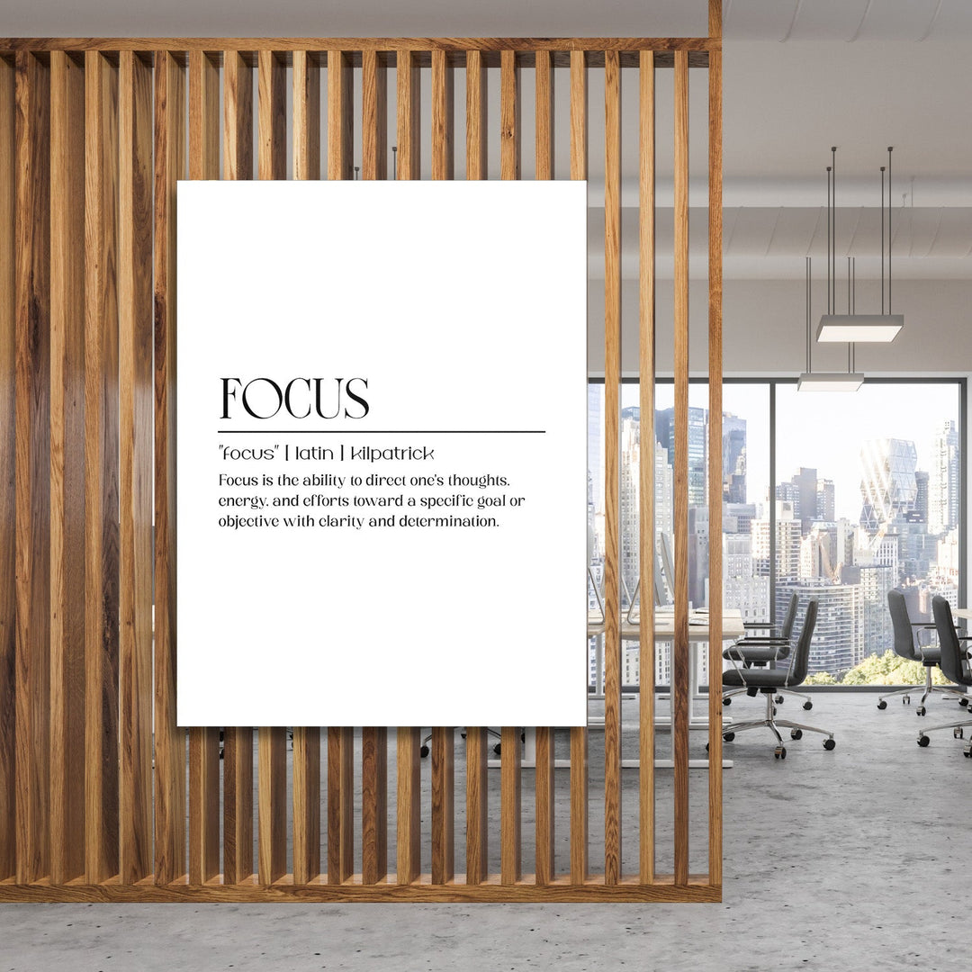 FOCUS motivational wall art with minimalist typography in a modern office behind a wooden grid