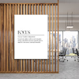 FOCUS motivational wall art with minimalist typography in a modern office behind a wooden grid