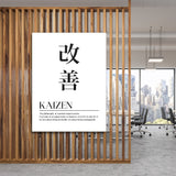 Kaizen motivational canvas print with Japanese kanji, hanging on a wooden slat wall in a modern office