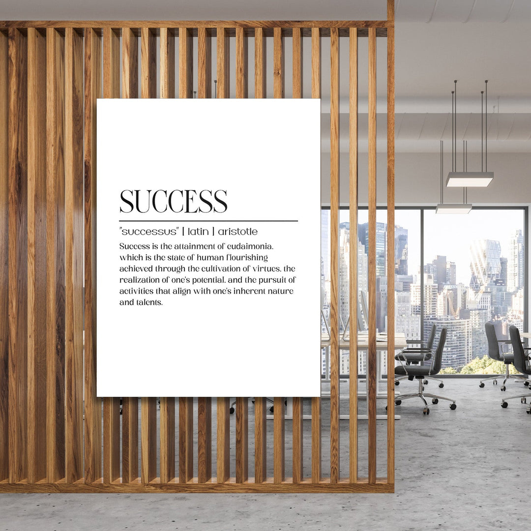 Motivational wall art with a minimalist quote about success in a modern office behind a wooden screen
