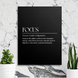Focus motivational wall art with a black minimalist canvas and white typography in front of a marble wall
