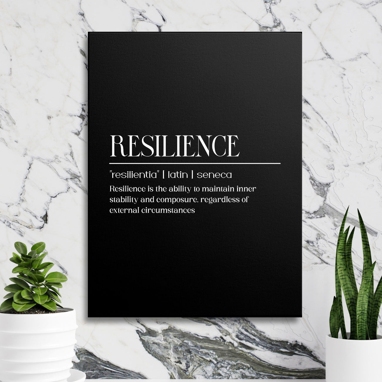 Motivational canvas print with a black-and-white Resilience quote hanging on a marble wall among green plants