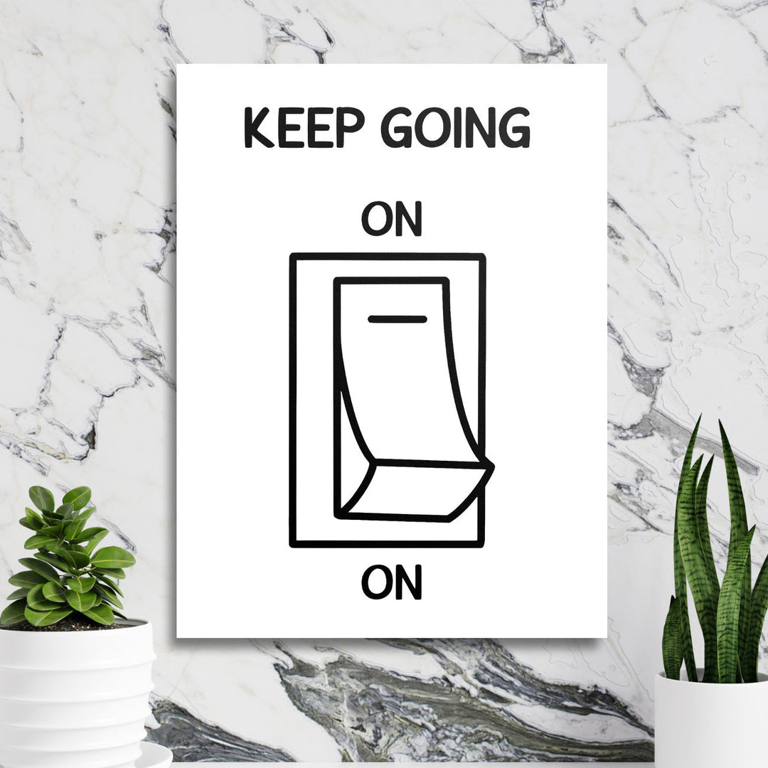 Motivational wall art with a black and white calendar graphic in a minimalist lifestyle arrangement on a marble wall