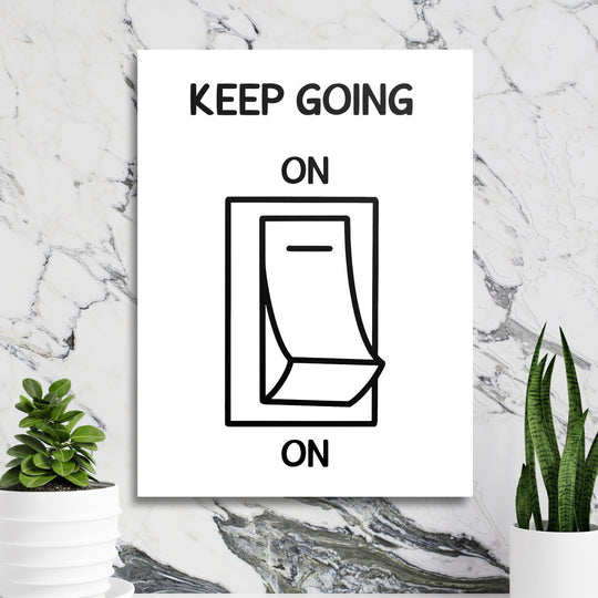 Motivational wall art with a black and white calendar graphic in a minimalist lifestyle arrangement on a marble wall