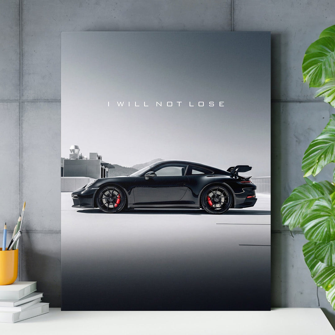 Motivational wall art with black sports car and quote "I WILL NOT LOSE" in a modern office