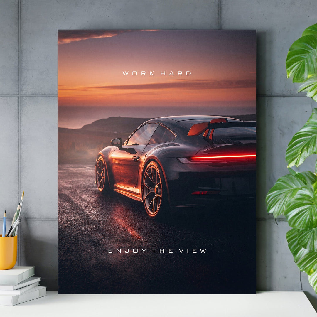 Motivational wall art with luxury sports car at sunset and minimalist quote for an office