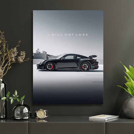 Motivational canvas wall art with black luxury sports car and white text I WILL NOT LOSE in a home office