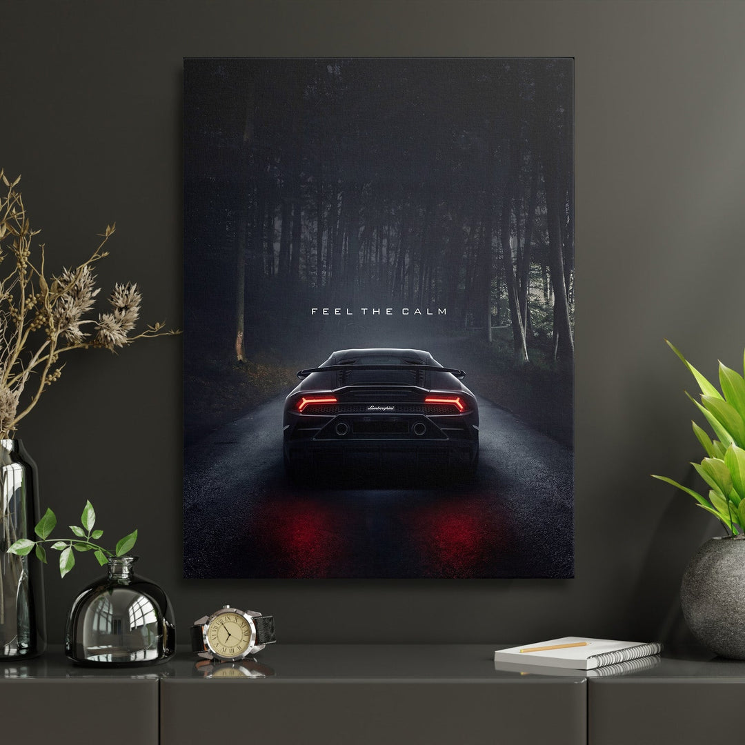 Motivational canvas print with a luxury sports car on a forest road and the quote “Feel the Calm”