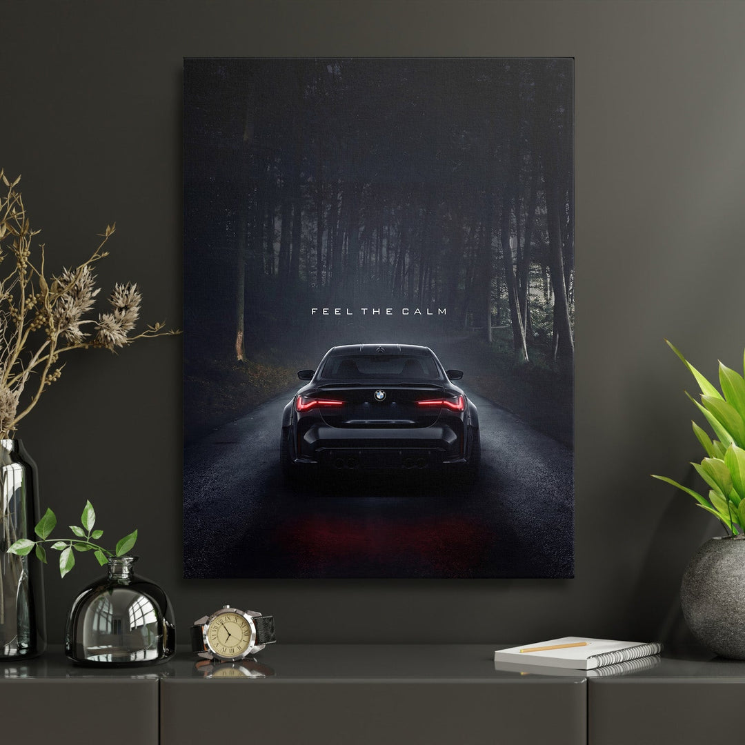 Motivational wall art with a night BMW on a forest road and the text “Feel the Calm” in a work zone